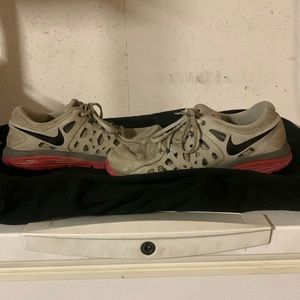 Nike light red and white running shoes